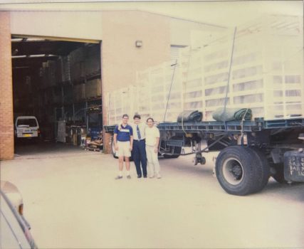 Old freight lorry in front of a warehouse